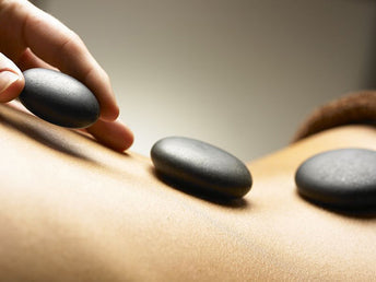 Massage aux galets chauds