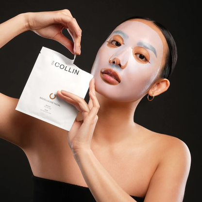 Biocellulose Facial Masque G.M. Collin - modèle appliquant le masque tissu sur le visage - Spa Santé Le Nénuphar